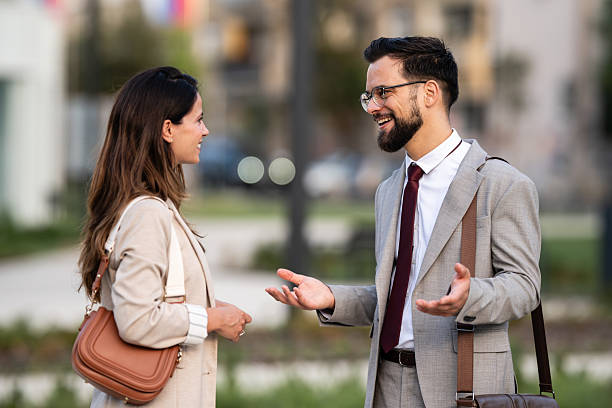 istock Businesspeople talking and gesturing during a pleasant conversation outdoors 2229679148