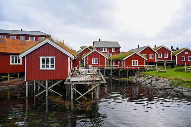 Traditional red Rorbu huts in Reine on the island of Moskenesøy, Lofoten, Norway.