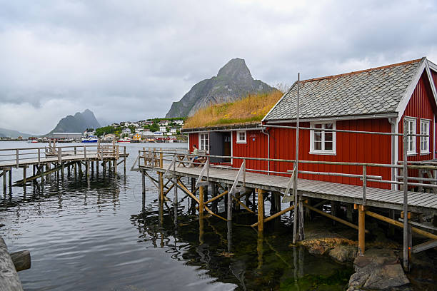 Traditional red Rorbu huts in Reine on the island of Moskenesøy, Lofoten, Norway.
