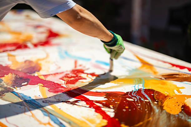 istock Artist's Hand Painting Canvas 2229681762