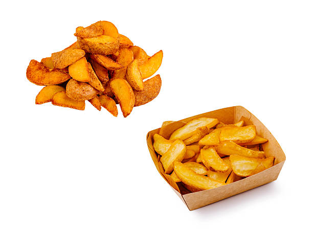 istock Crispy potato wedges served in a box and piled high on a plate 2229682498