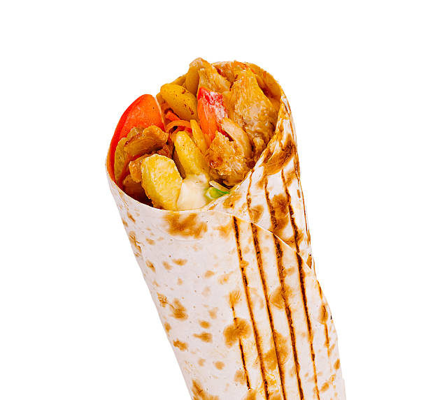 istock Delicious chicken wrap with fresh vegetables and sauces on a grill 2229683460