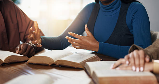 istock Hands, explain and woman with group for Bible study, worship or learning gospel for religion. Faith, Christianity and knowledge of God, scripture or theology talk for guidance with spiritual growth 2229683483