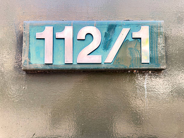 istock Close up house numbers on concrete block 2229683590