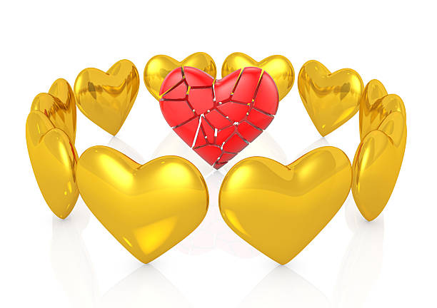 Broken red heart with many gold hearts around it
