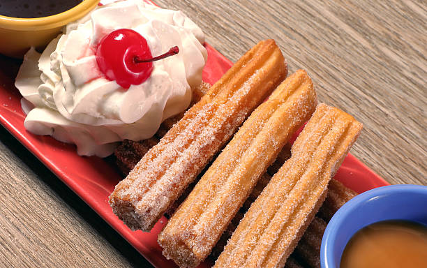 Close up sweet Mexican food churro dish on wooden table