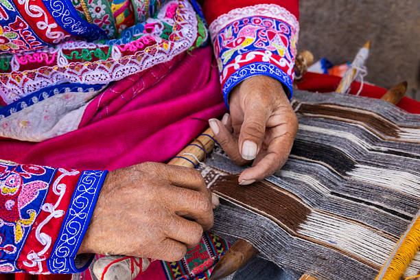 istock Peruvian woman weaving near Colca Canyon, Peru 2229686891
