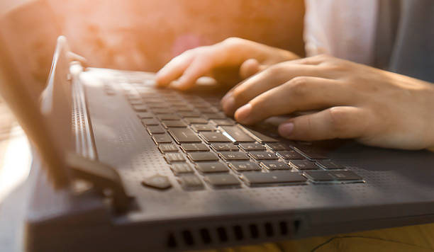 istock A man works on a laptop outdoors, hands on a keyboard closeup. 2229687925