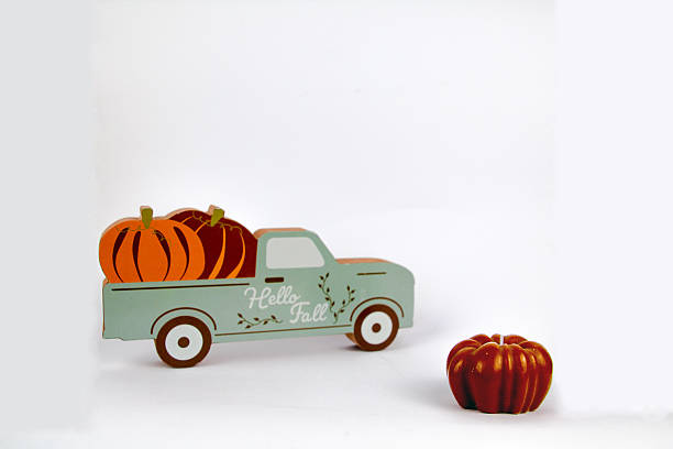 istock Isolated car figurine with pumpkin 2229689249