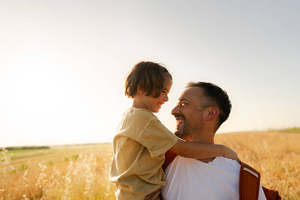 istock Cuddling in the fields of gold with my dad 2229692688
