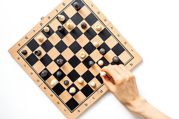 istock Hand is holding chess piece on chessboard. Game concept 2229699213