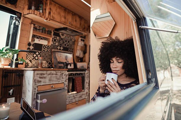 istock Woman relaxing in her camper van 2229703896