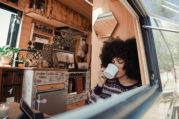 istock Woman relaxing in her camper van 2229704596