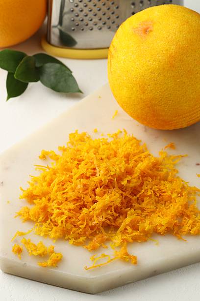 istock Fresh orange zest and fruits on light table 2229705592