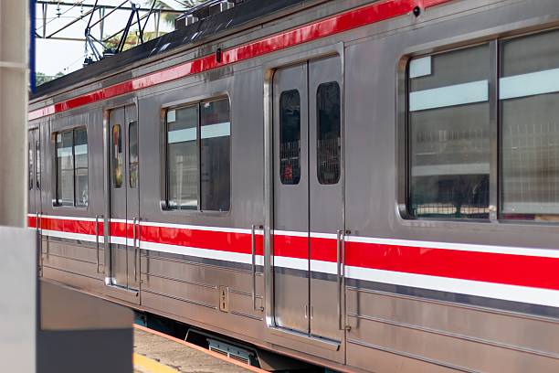 istock Electric commuter train carriage with closed doors at a station 2229709009