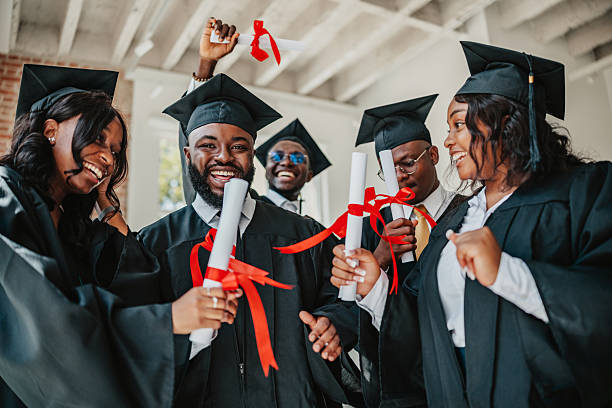 istock Celebrating graduation among a joyful multiracial group of university students on campus 2229709905