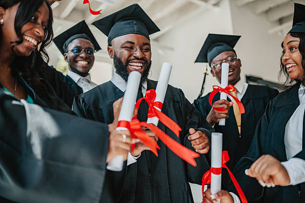 istock Celebrating graduation with joy and friendship among black university students on campus 2229711271