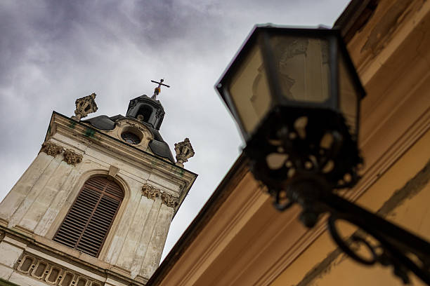 A towering historic church stands prominently, showcasing intricate architectural details