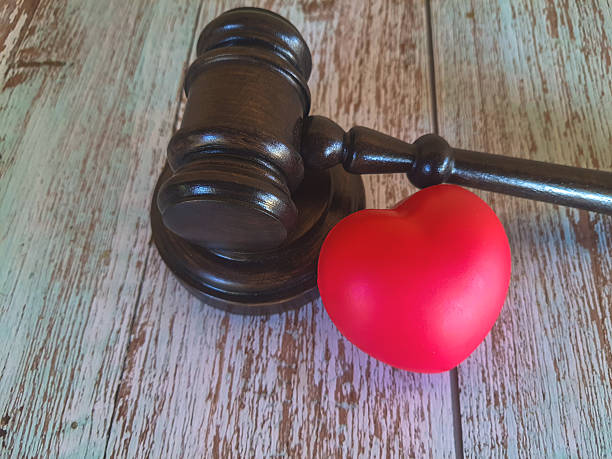 istock Judge's gavel with red heart 2229712822