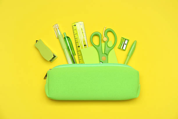istock Pencil case and different stationery on yellow background, flat lay 2229714368