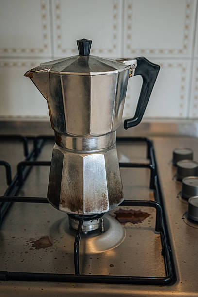 istock Vintage Moka Pot Brewing on Gas Burner in Rustic Kitchen 2229714831