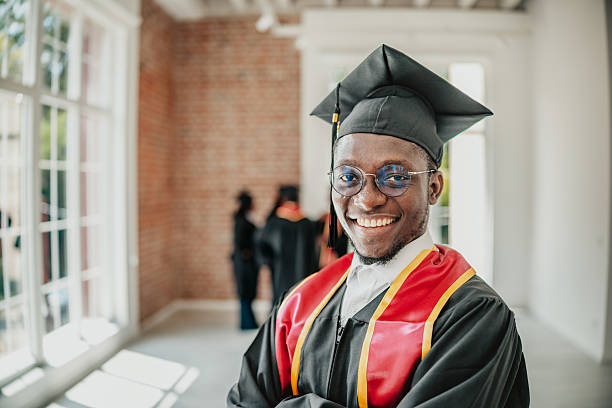 istock Graduation celebration of young African university students in a joyful campus setting 2229715094