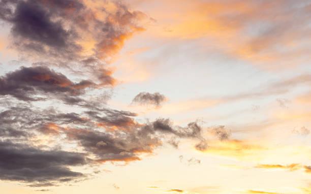 istock clouds under a red, yellow, and blue sky at sunset 2229723380