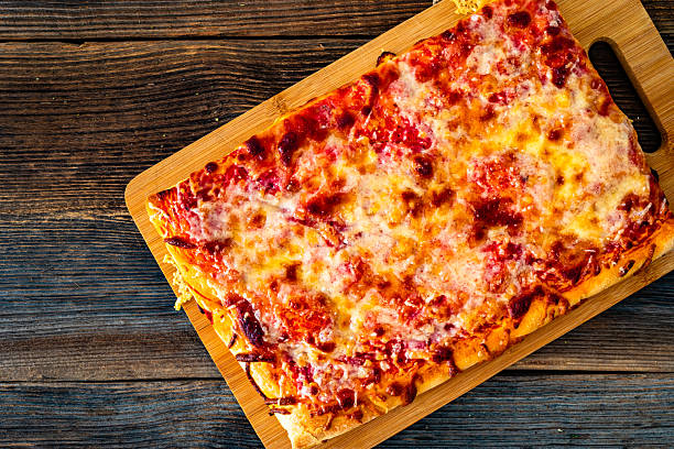 Pizza al metro margherita on wooden table