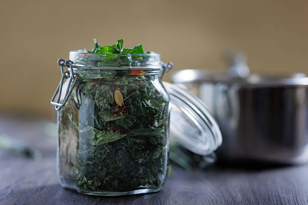 A close-up of preparing pickled cavolo nero kale in a home kitchen.