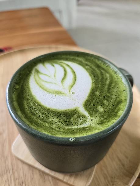 istock Freshly Whipped Matcha Latte with Leaf Design on Creamy Foam 2229729585