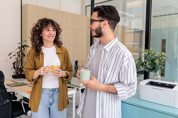 istock Two Coworkers Enjoying Coffee Break Together 2229730019