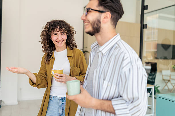 istock Two Coworkers Enjoying Coffee Break Together 2229730044