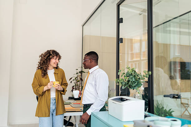 istock Two Coworkers Enjoying Coffee Break Together 2229730062