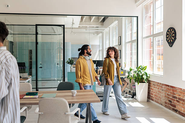 istock Smiling Coworkers Arriving at Work 2229730762