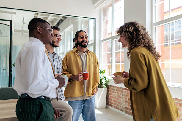 istock Group of Coworkers Enjoying Coffee Break at Work 2229730850