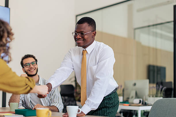 istock Coworkers Chatting and Enjoying Coffee Break at Work 2229731324