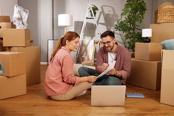 istock Couple organizing their relocation expenses in new apartment 2229731474