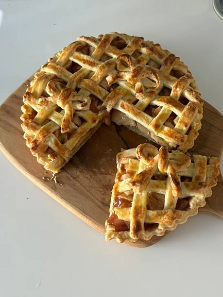 istock Homemade Apple Pie with fresh apples on white kitchen table, top view, flat lay. Thanksgiving traditional dessert, Thanksgiving tart preparation, autumn bakery. Crispy weather sweets. Recipe 2229731643