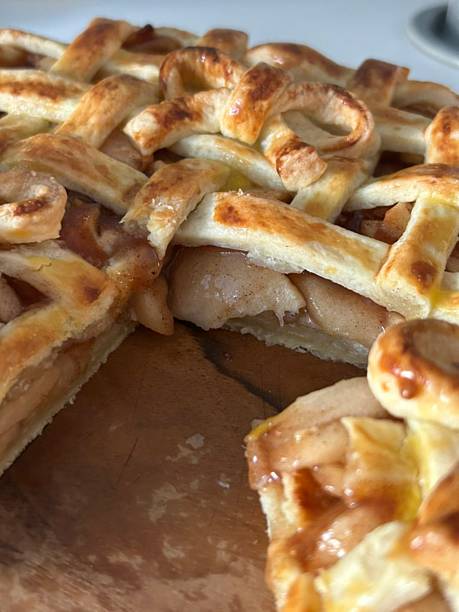 istock Homemade Apple Pie with fresh apples on white kitchen table, top view, flat lay. Thanksgiving traditional dessert, Thanksgiving tart preparation, autumn bakery. Crispy weather sweets. Recipe 2229731822
