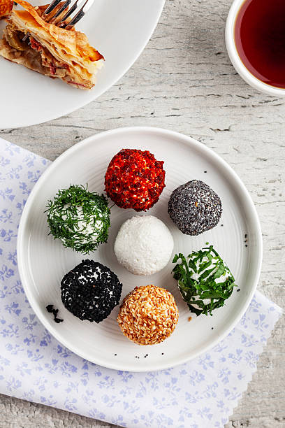 Cheese Balls. Cheese Ball with spices. Cottage cheese balls with herbs.
