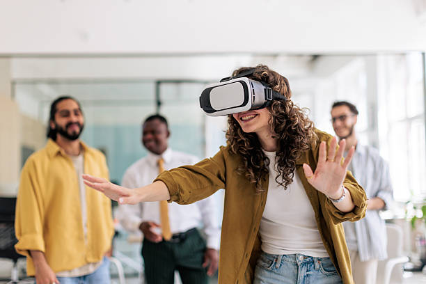istock Group of Coworkers Having Fun With VR Headset During Break 2229732901
