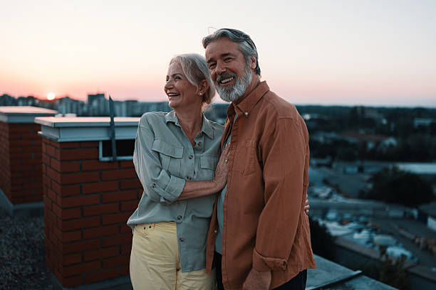 istock Romantic senior couple hugging at rooftop sunset 2229735684