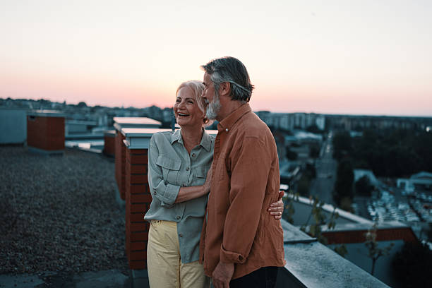 istock Senior couple enjoying sunset on rooftop 2229735695