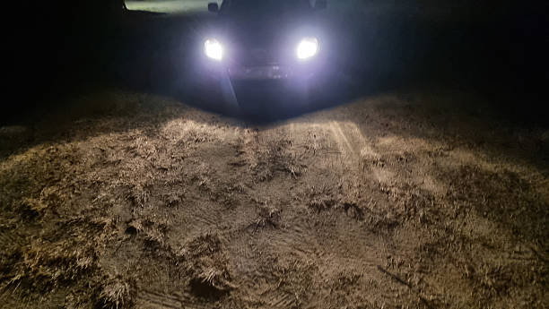 istock car lights in dark night hour 2229737097