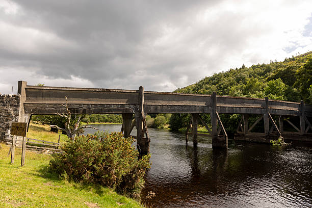 istock A bridge over a river with a sign on the side 2229737617