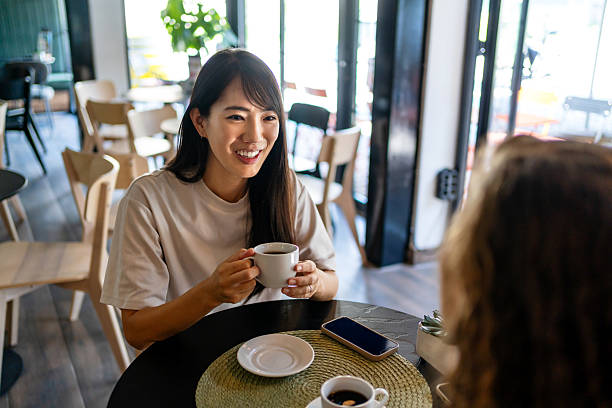 istock Two young women having coffee together in a cafe 2229739414
