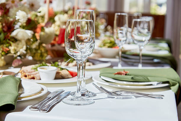 istock Within the elegant chamber, a finely set table showcases a harmonious blend of candles and flowers, their arrangement casting alluring shadows. The wedding exudes the aesthetics of Provence. 2229739725