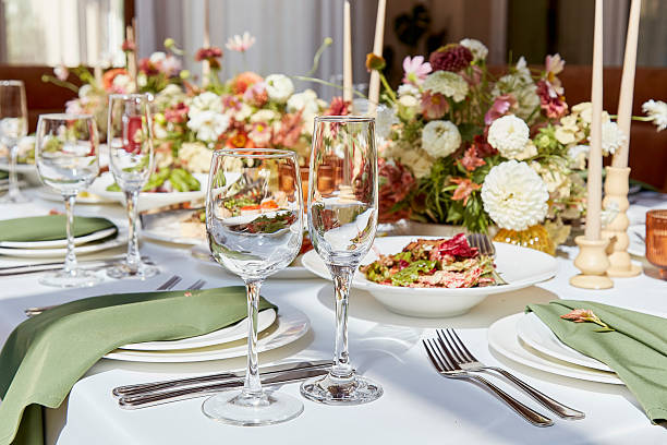 istock Aesthetic table setting with candles and flowers decorations. Restaurant chamber event under sunlight shadows 2229739737
