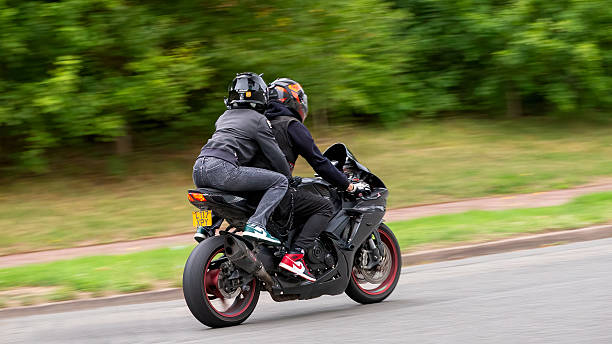 Woman rading on very fast motorcycle 
