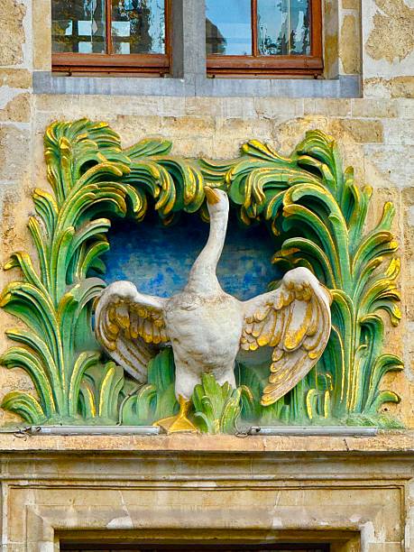 Stone swan relief on building facade in New Town, Warsaw, Poland. Architecture details. Art.